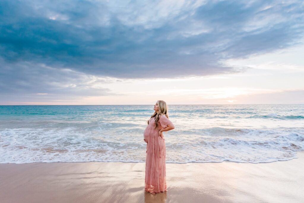 Tropical beach maternity photoshoot of a lady